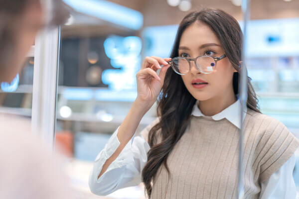 Woman trying on glasses